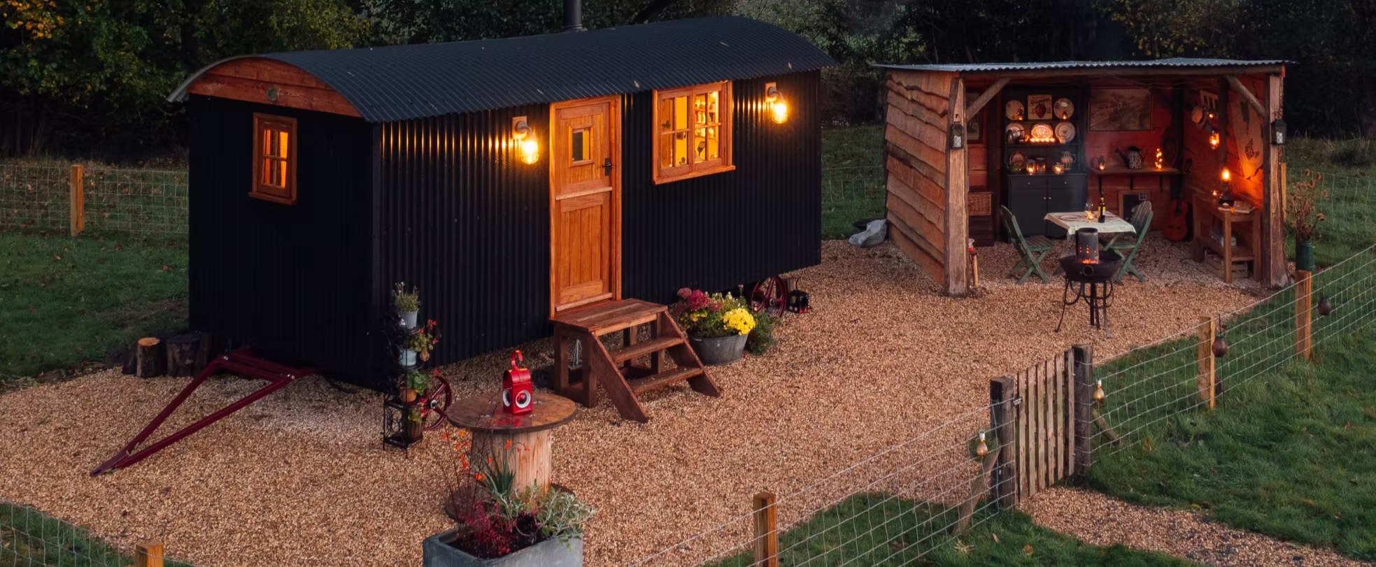 Millie the Hut in the evening light, with the meadow and hills behind